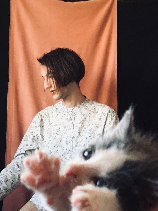 A portrait picture of me with a bomber kitty in the foreground